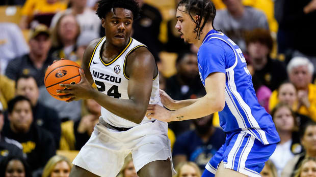 Dec 28, 2022; Columbia, Missouri, USA; Missouri Tigers guard Kobe Brown (24) looks to pass as Kentucky Wildcats forward Lance Ware (55) defends during the second half at Mizzou Arena. Mandatory Credit: Jay Biggerstaff-USA TODAY Sports